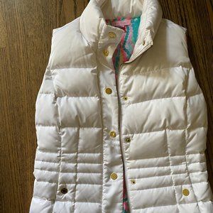 white lilly pulitzer vest with cold accents